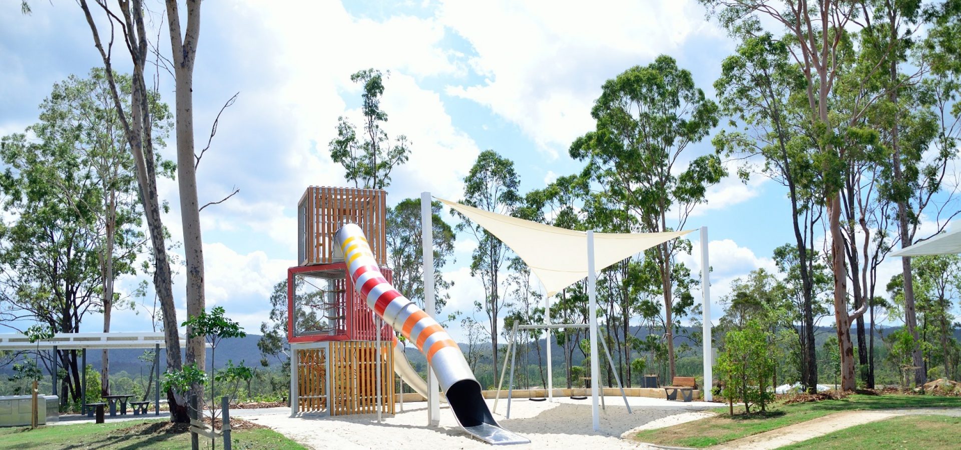 Playground tower with stainless steel slide