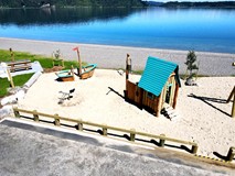 Oasis sand house with desk and crane